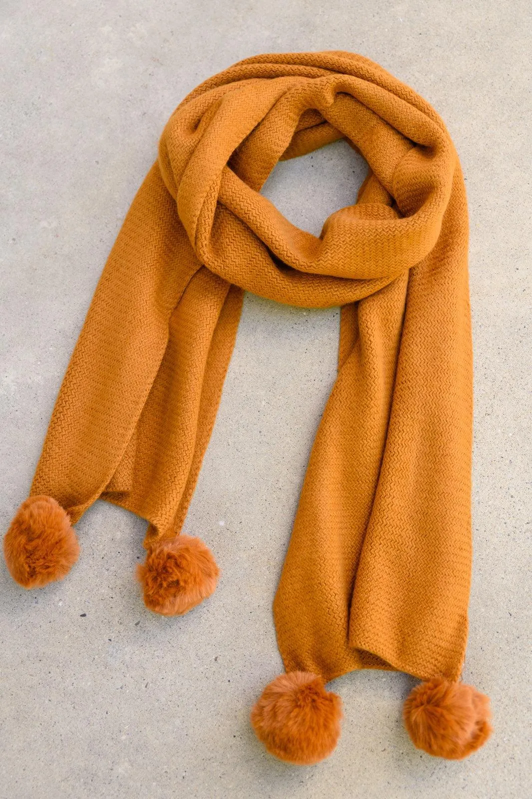 Hazel Blues® | Knitted Fuzzy Pom Pom Scarf In Ginger